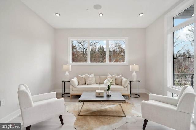 living room featuring recessed lighting and baseboards