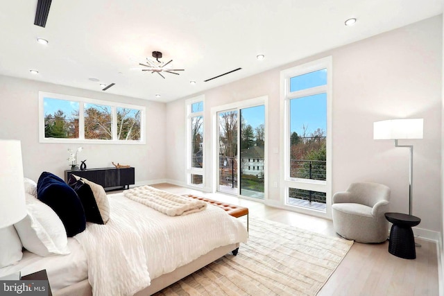 bedroom featuring access to outside, recessed lighting, baseboards, and wood finished floors