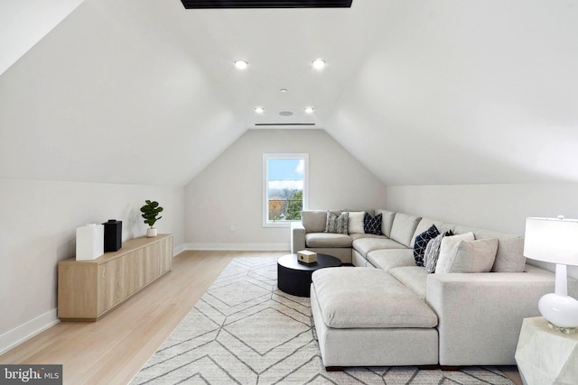 living room with light wood-type flooring, vaulted ceiling, baseboards, and recessed lighting