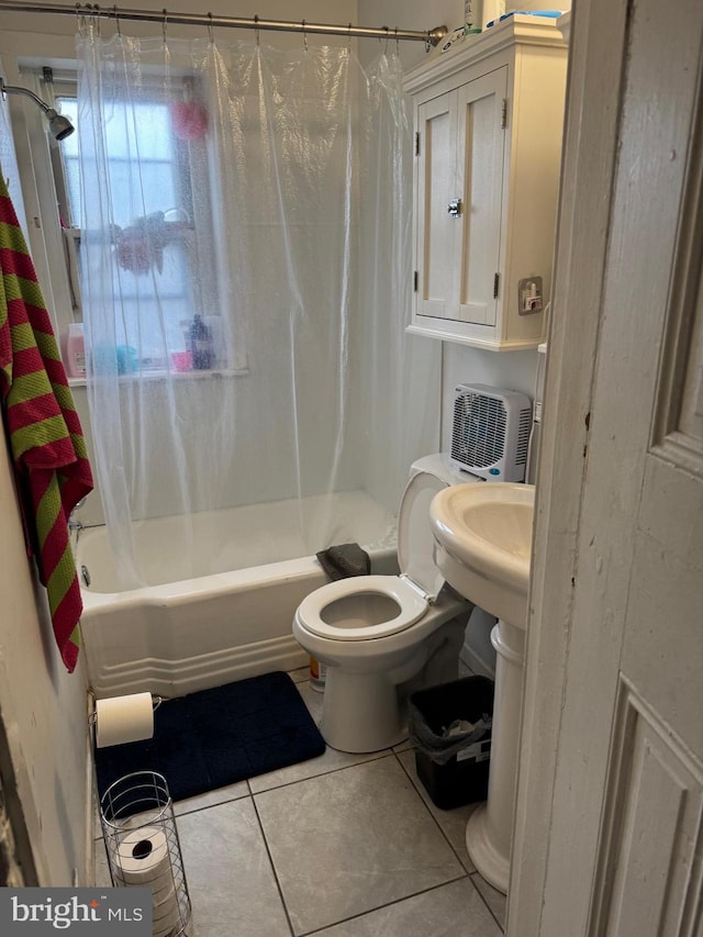 full bath with shower / bath combo, toilet, and tile patterned floors