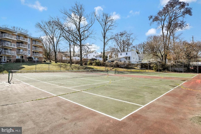 view of sport court with fence