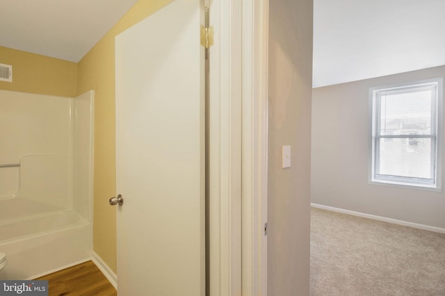 full bathroom featuring visible vents, baseboards, toilet, and  shower combination