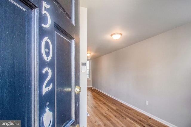 interior details with wood finished floors and baseboards