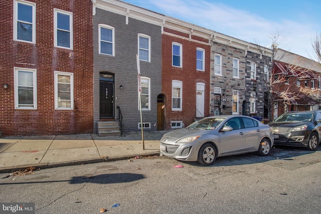 multi unit property with brick siding and entry steps