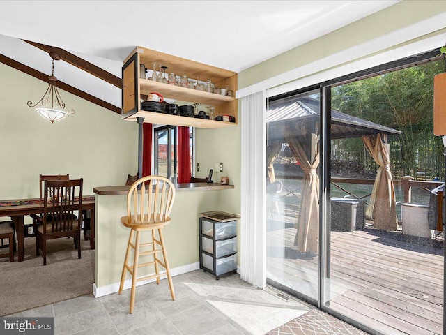 interior space with decorative light fixtures and baseboards