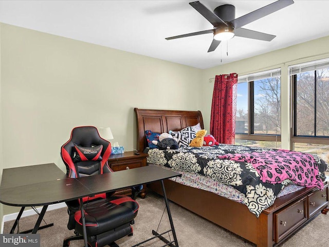 carpeted bedroom with a ceiling fan