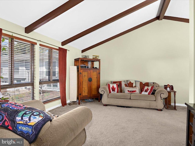 carpeted living room with baseboards, beam ceiling, and high vaulted ceiling