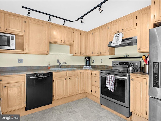 kitchen with under cabinet range hood, appliances with stainless steel finishes, light brown cabinets, and a sink