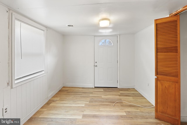 entryway featuring light wood-type flooring and baseboards