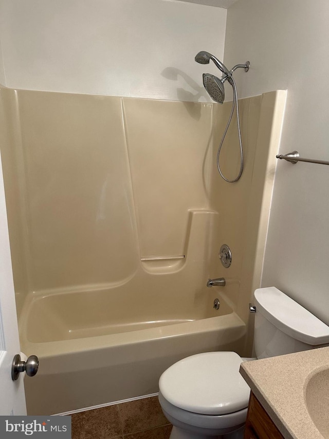 full bath with toilet, vanity, and shower / bathing tub combination