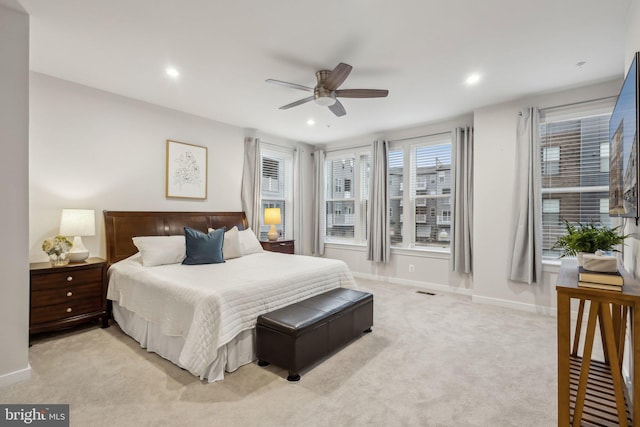 bedroom with light carpet, baseboards, a ceiling fan, and recessed lighting