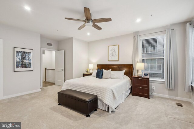 bedroom with recessed lighting, light colored carpet, visible vents, and baseboards