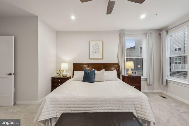 bedroom with baseboards, visible vents, light colored carpet, ceiling fan, and recessed lighting