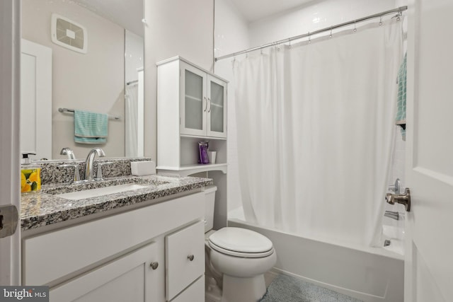 bathroom featuring shower / bath combination with curtain, vanity, and toilet