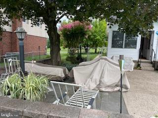 view of community featuring fence