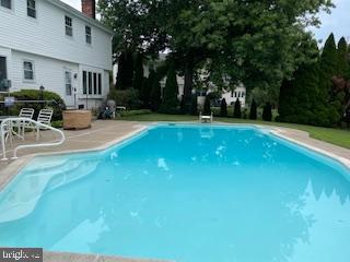 pool with a patio area