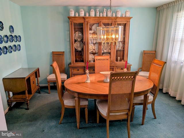 dining space with an inviting chandelier, carpet, and baseboards