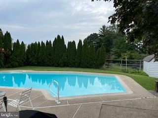 pool featuring fence