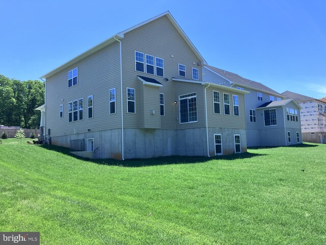 1704 Copperleaf Blvd, Hanover, MD 21076 - back of property featuring a lawn