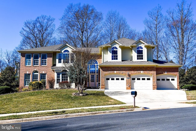 view of front facade with a front yard, brick siding, driveway, and roof with shingles