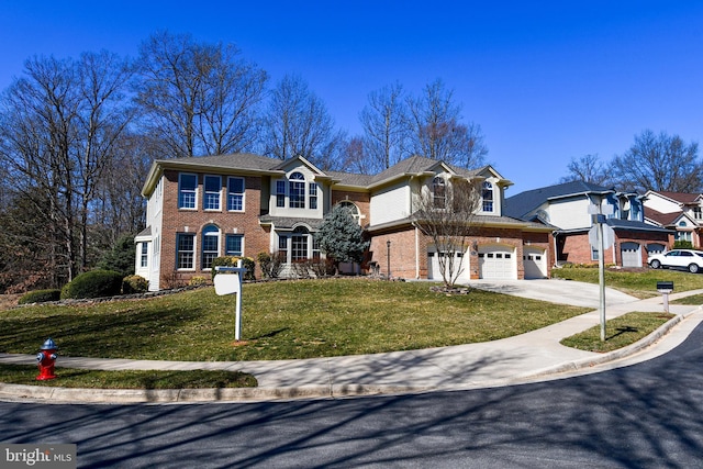 view of front of house featuring driveway, brick siding, a front lawn, and an attached garage