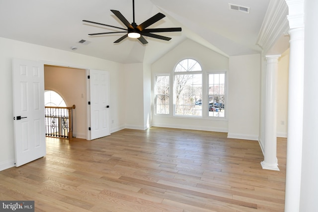 unfurnished room with light wood-type flooring, visible vents, ceiling fan, and ornate columns