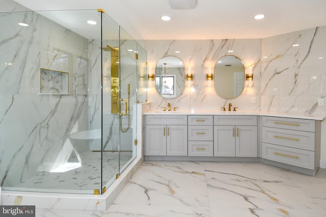 full bath featuring marble finish floor, stone wall, and a marble finish shower