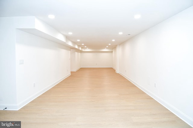 interior space featuring recessed lighting, light wood-style flooring, and baseboards