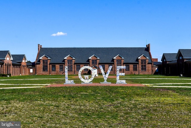 surrounding community featuring a lawn