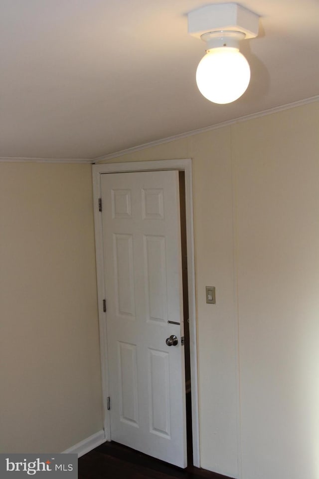 spare room featuring ornamental molding and baseboards