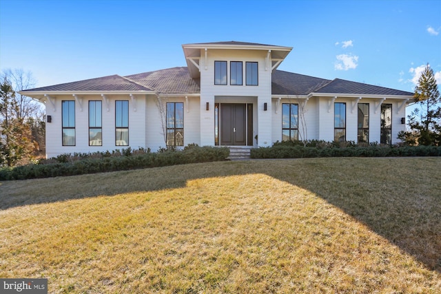 prairie-style house featuring a front lawn