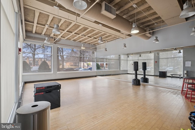 exercise area featuring visible vents and hardwood / wood-style flooring