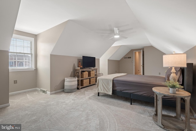 bedroom with visible vents, lofted ceiling, carpet, and baseboards