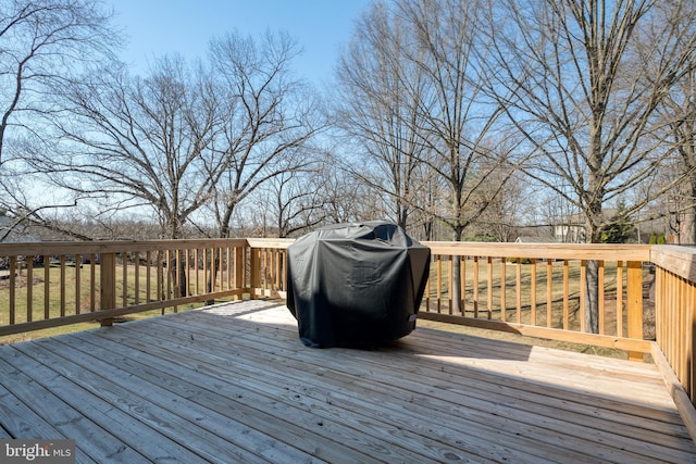 wooden deck with grilling area