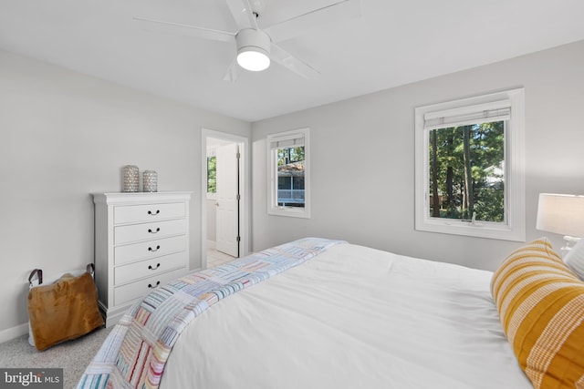 bedroom with baseboards, carpet floors, and ceiling fan