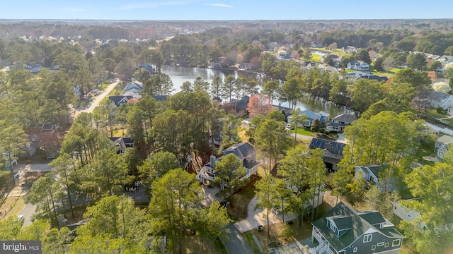 bird's eye view featuring a residential view and a water view
