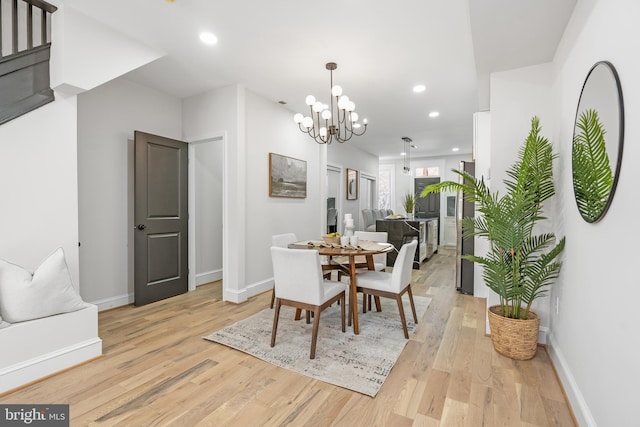 dining area with light wood-style floors, recessed lighting, and baseboards