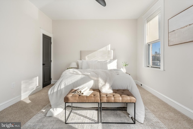 carpeted bedroom featuring baseboards and visible vents