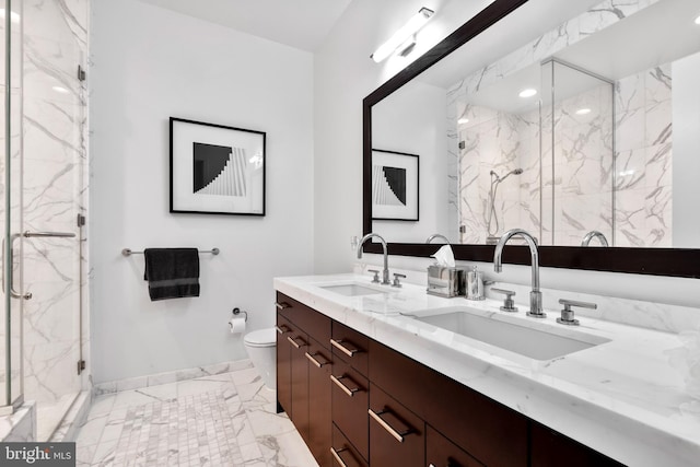 full bath featuring marble finish floor, a sink, a marble finish shower, and toilet