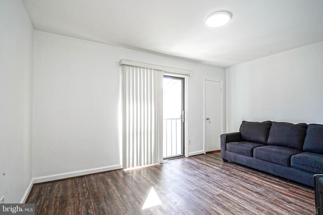 living area featuring wood finished floors and baseboards