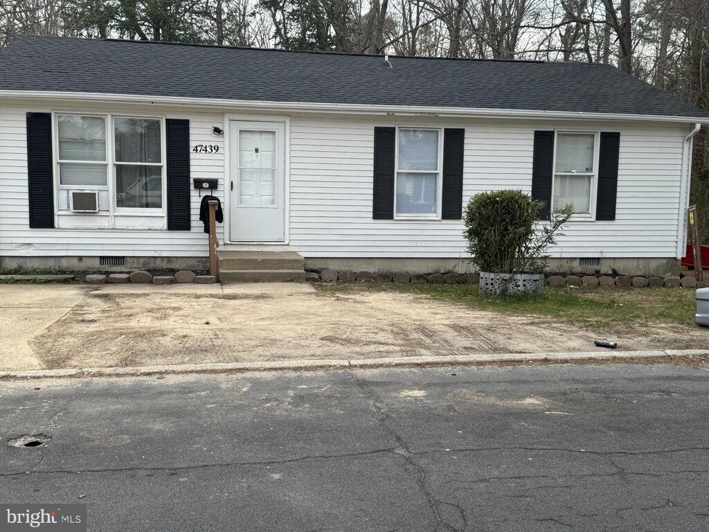 view of front of property featuring roof with shingles, crawl space, and entry steps
