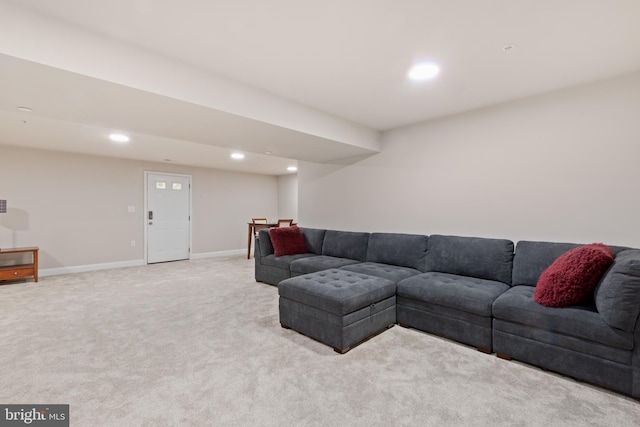 living area with recessed lighting, light colored carpet, and baseboards