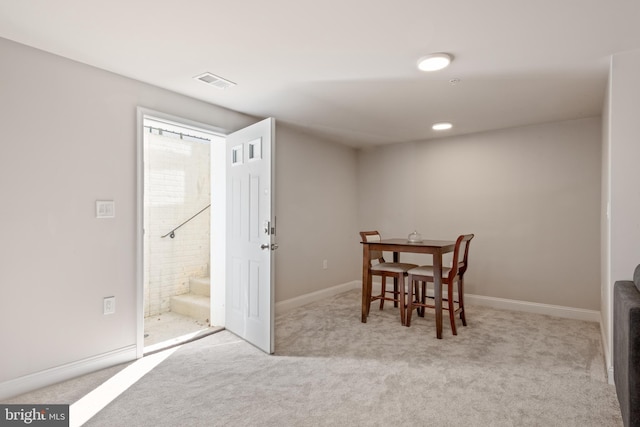 dining room featuring baseboards, visible vents, and carpet floors