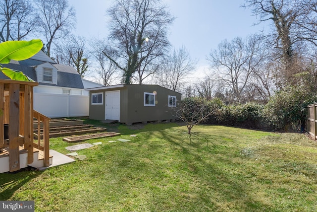 view of yard featuring an outbuilding and a fenced backyard