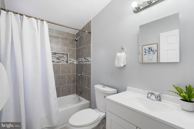 full bath with shower / bath combo, vanity, and toilet