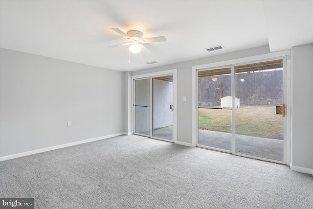 unfurnished bedroom featuring access to exterior, carpet flooring, visible vents, and baseboards