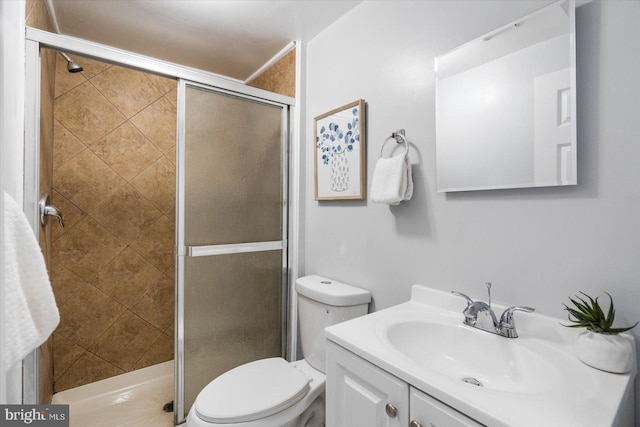 full bath with toilet, a shower stall, and vanity