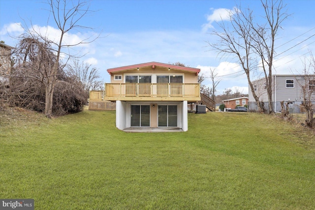 rear view of property featuring stairway, cooling unit, a yard, and a deck