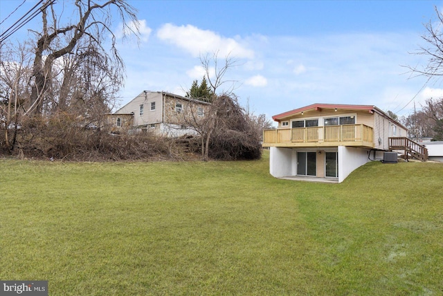 view of yard featuring a deck and cooling unit