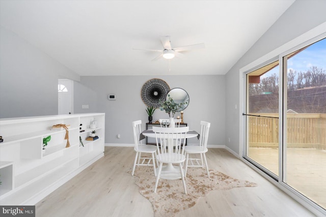 dining space with ceiling fan, baseboards, and wood finished floors